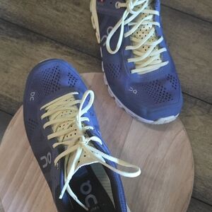 On Running Blue and Yellow Athletic Shoes